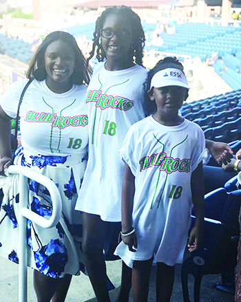 Paris (center) and her sisters, Talia (left) and Olivia (right)