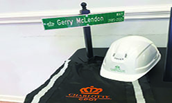 Retirement street sign, CDOT hard hat and bag 